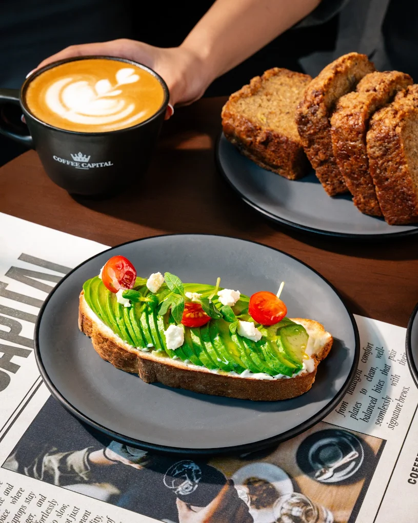 Avocado toast with cappuccino and banana bread
