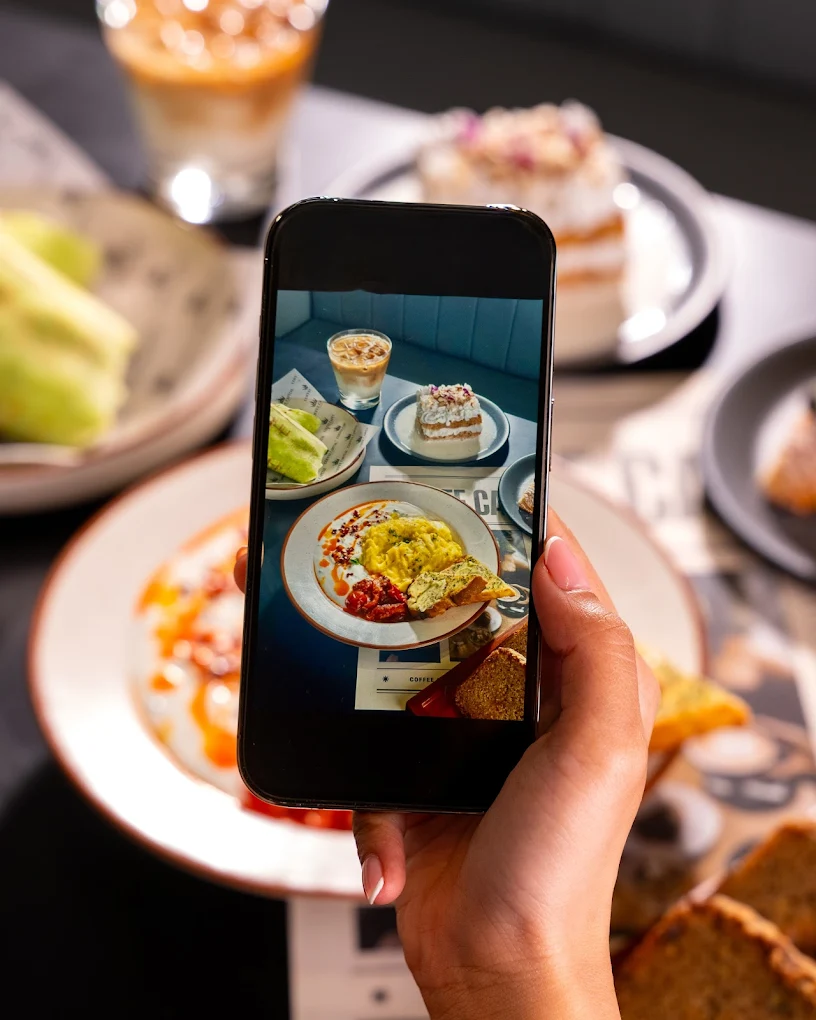 Photographing a spread of food and drinks at Coffee Capital